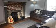 Lounge with cosy log burning stove