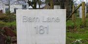 Signage at Barn Lane reads 'Barn Lane 181'