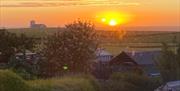 View from the back of the property at sunset looking Northwest towards famous whitewashed church