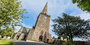 Image of the front of Bangor Abbey on a bright sunny day