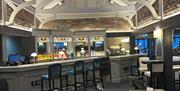 Interior view of the Stables Groomsport showing bar area and beamed ceiling in New England Style