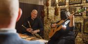 Belfast Traditional Music Trail musicians playing traditional irish instruments