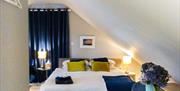 King sized bed and dining area