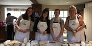 Ladies making soda bread on the griddle