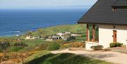 One of our lodges along with the view of the coast.