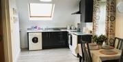 View of the open plan area including the kitchen in Binnian View Apartment