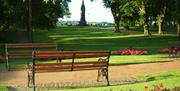 Park bench in the summer time at Castle Gardens