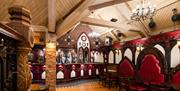 View of red leather seats, bar and dancefloor at Charlie's Bar Enniskillen