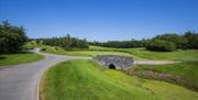 Image is of driveway around golf course