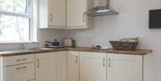 Kitchen with window above sink.