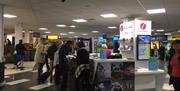 Travelers using the information kiosk.