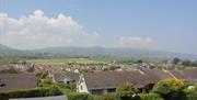 View that guests have from the Jacaranda Room and Guest Lounge that shows the Antrim Glens and the landscape of the local village.