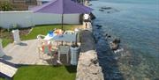 Decking and seating area by the sea