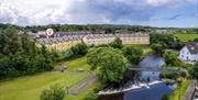 Photograph aerial view of townhouses on the River Bush