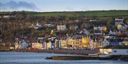 Whitehead promenade with coloured houses and old outdoor swimming pool