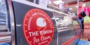 Ice cream serving counter with The Rinkha ice cream logo