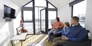 A family sitting inside the house boats at Ballyronan Marina