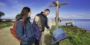 Family scanning the interactive QR code at Ballyronan marina