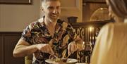 A couple in a restaurant having a meal