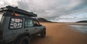 Land Rover Parked on Beach