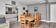 Photograph of open plan living, kitchen, dining area