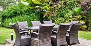 Photograph of outdoor seating area with 8 chairs