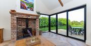 Living room view looking out patio doors to garden