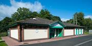 A building in the caravan park with a five star rating plaque.