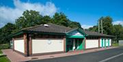 A building in the caravan park with a five star rating plaque.