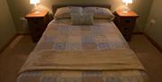 double bed with 2 bedside lockers