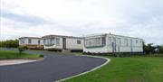 Image is of 3 caravans in a row