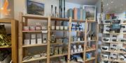 Shelf displays of Antrim Rain Soap and arts and craft items for sale