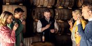 A group taking part in a distillery tour at Echlinville