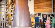 Tour group learns about Echlinville's field-to-glass distillery