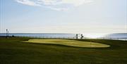 Putting green on the lawns of Slieve Donard with views of the Irish Sea