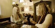 Two girls catching up at The Errigle Bar