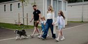 family walking dog