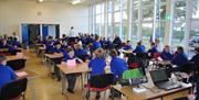 Image shows children in a classroom