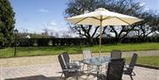 outdoor seating area with table and 6 chairs