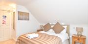 Double bed with bedside table and lamp