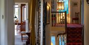 luxury corridors with stairs leading to bedrooms
