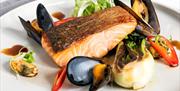 A plate of pan-seared Glenarm salmon, with Strangford Lough mussels and red chilli.