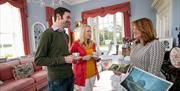 A couple having tea during a guided tour if the estate.