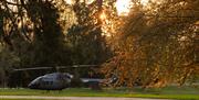 Helicopter landing at Gilford Castle Estate