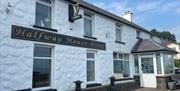 Whitewashed wall exterior of Halfway House Hotel in Ballygally