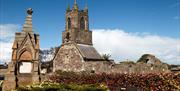 A photo of the side of Holywood Priory on a sunny day