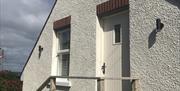 Front view of Rathlin Sound Apartment with 4 steps to front door