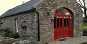 Mill Cottage showing red double doors