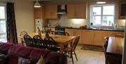 Kitchen area with large dining table and window