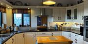 Kitchen with high- and low-level cupboards.